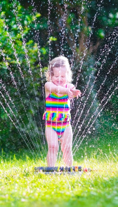 Custom Electrical says that keeping electronics away from the sprinklers, pools, and other water helps keep kids safe.