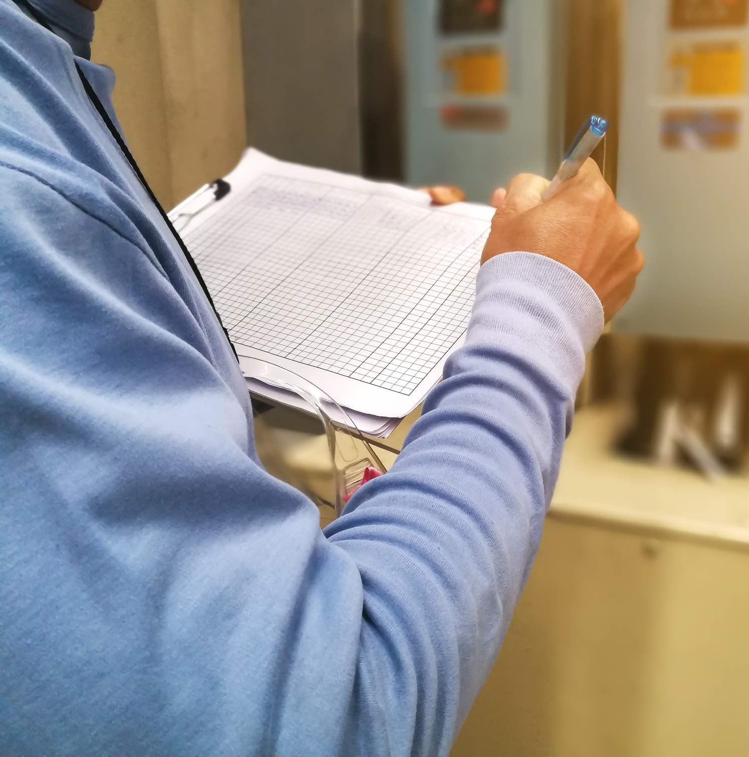 A Custom Electrical employee doing an inspection on a home as one of the best electricians in Utah.