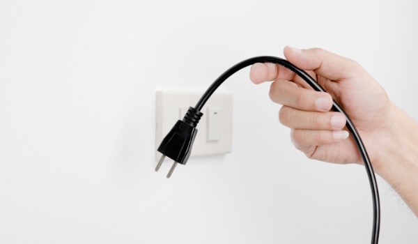 Custom Electrical suggests unplugging cords from outlets when they aren't in use.