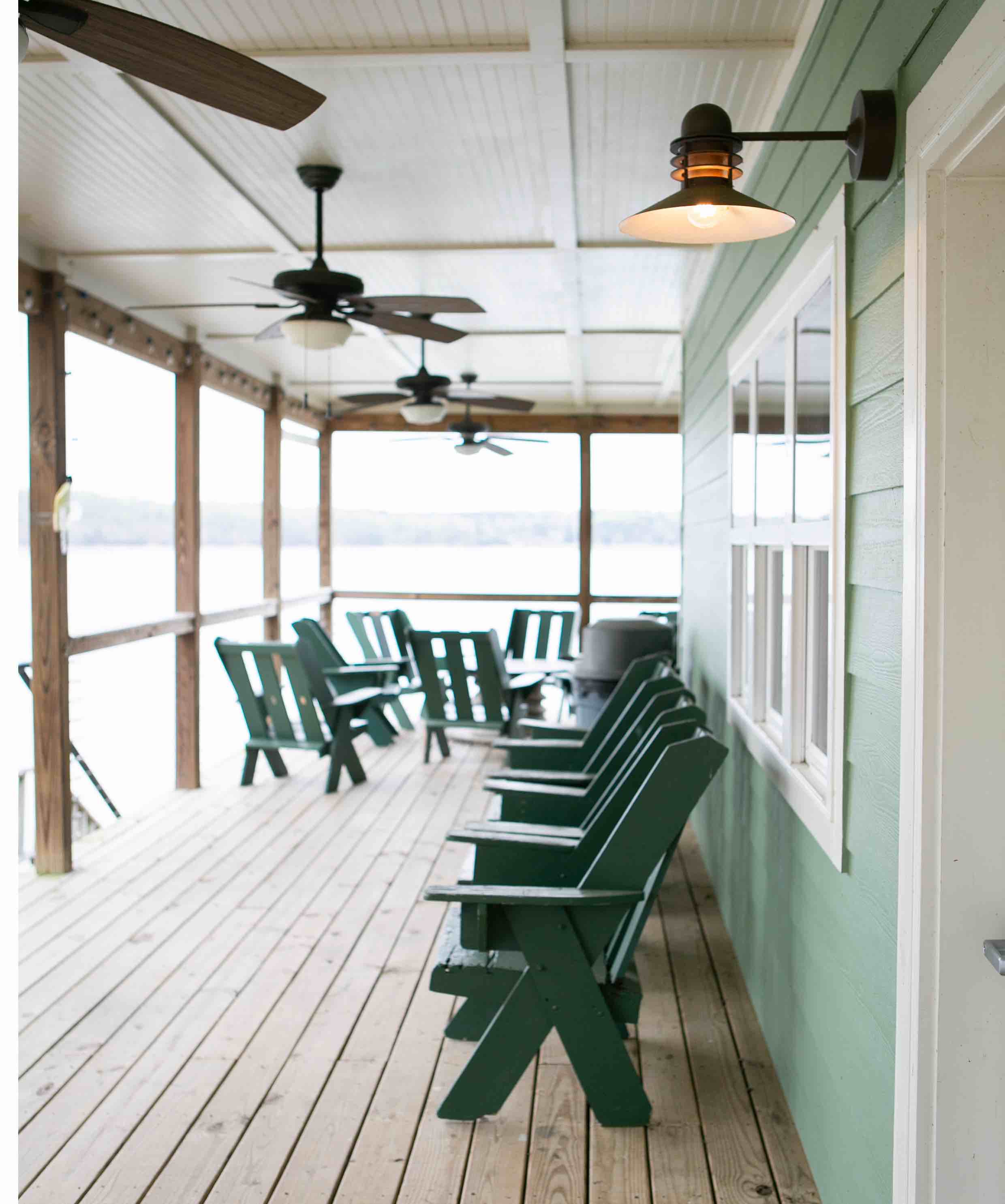 Custom Electrical can help with outdoor wiring projects like these outdoor lights and fans on this beachy deck.