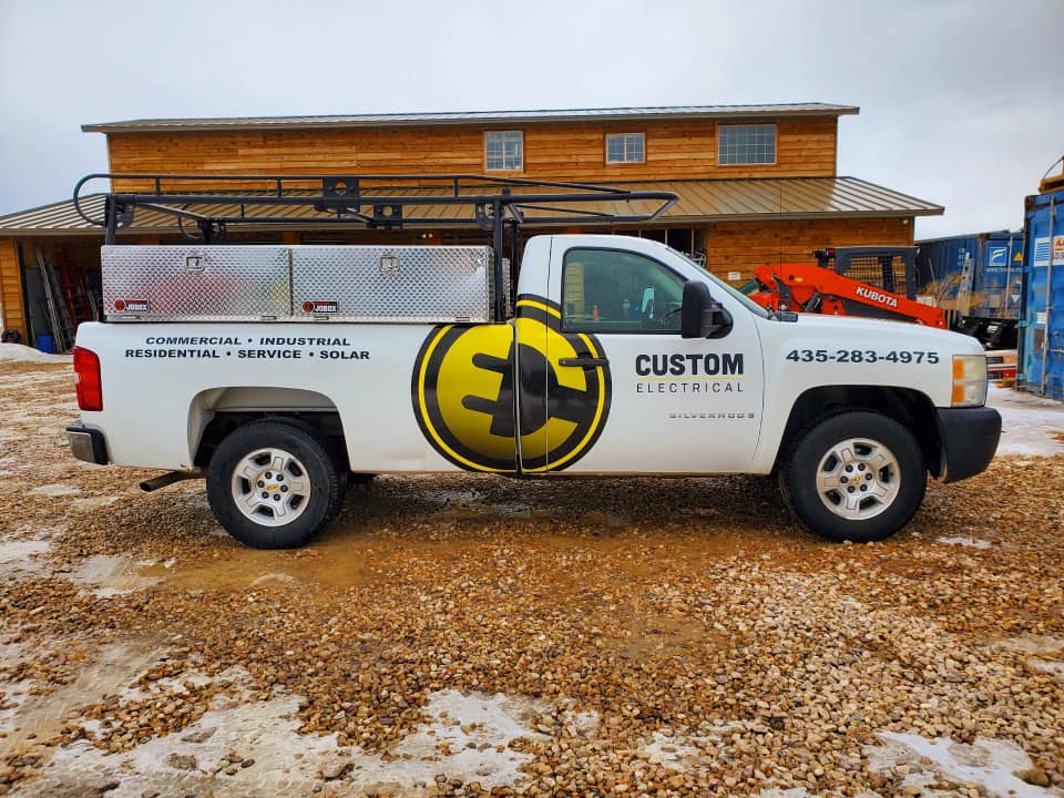 Custom Electrical tucked parked outside a cabin after a Utah home electrical repair appointment.