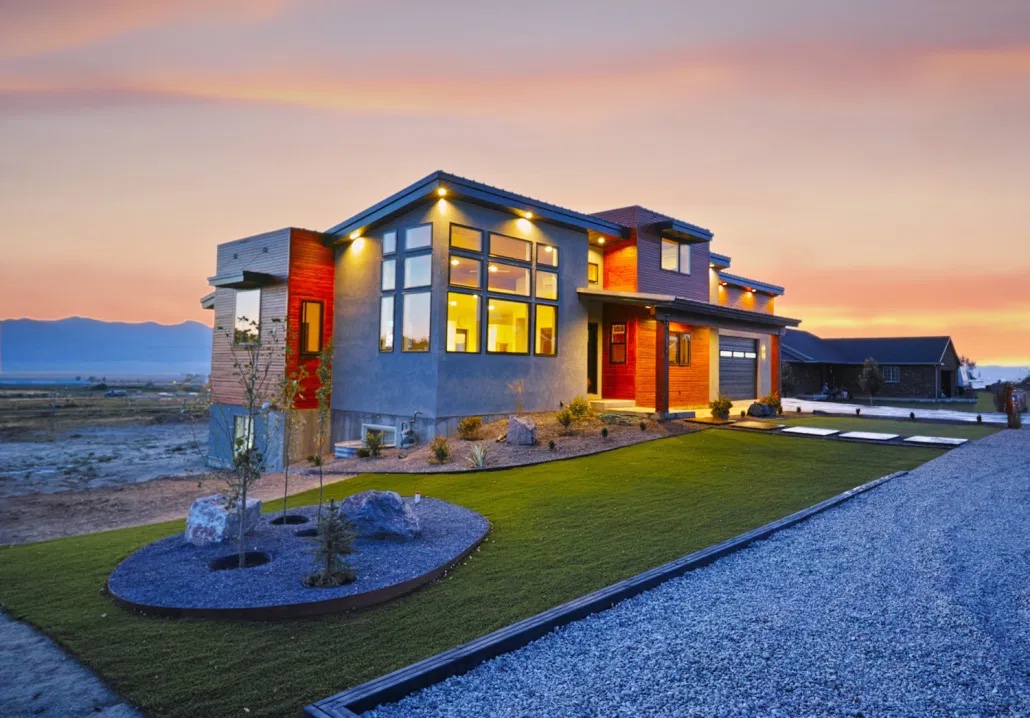 Custom Electrical new construction wiring in Utah being demonstrated by a modern home with soft outdoor lighting.
